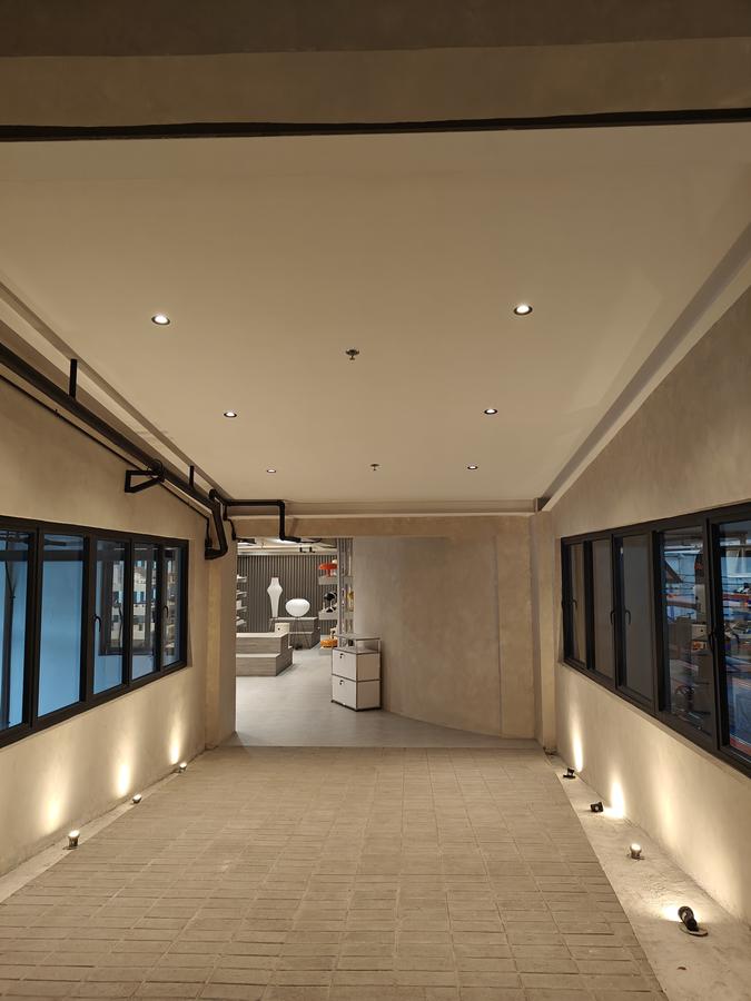 Showroom Corridor — Downlights & Ground Uplights